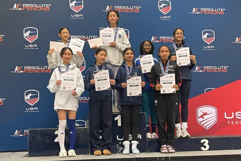 Girl Fencers Pose With Awards