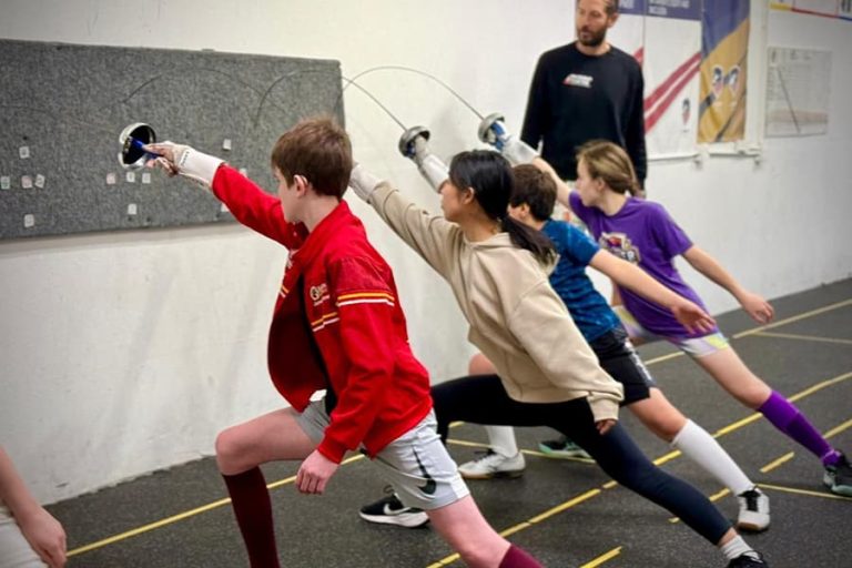 Junior Fencers Practice Against A Wall