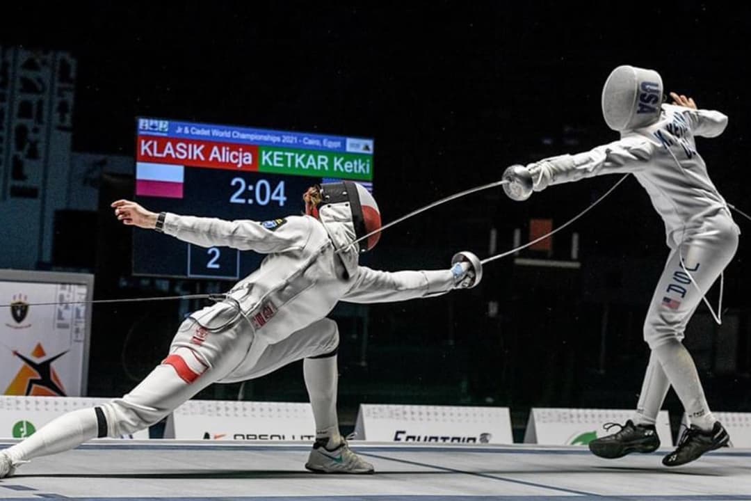 Fencers With Masks And Epees Square Off